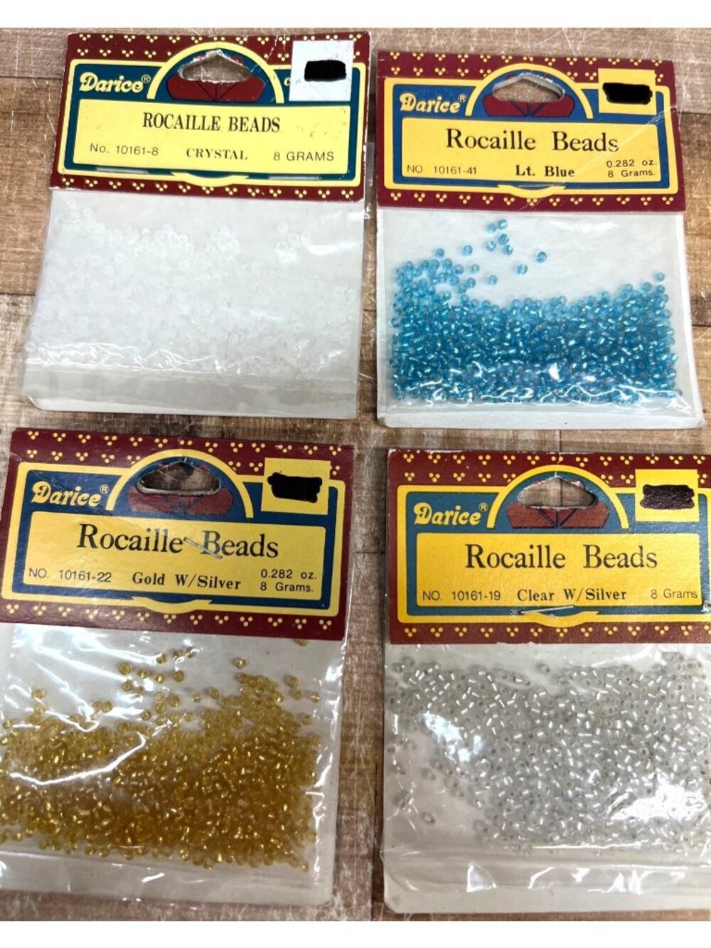 Darice Rocaille Beads Assorted Colors Crystal Gold Lt. Blue Clear 8 Grams Each